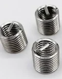 Ống ren lót bằng thép không gỉ dùng để cấy ren, dạng lò xo cuộn xoắn, lắp vào lỗ đã khoan rộng và taro lại để phục hồi lỗ ren về đúng cỡ ban đầu